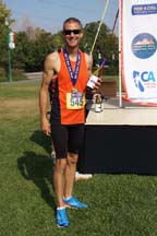 Sean Curry wins the wine at the Nor Cal Half Marathon, photo by Alheli Curry